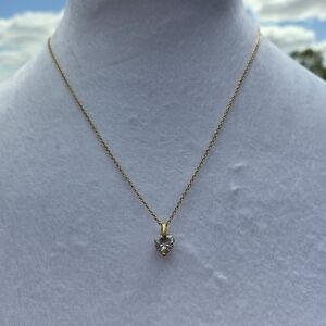 19. Elegant Gold Necklace with Silver Pendant